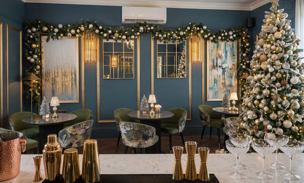 Nocturne with a Christmas tree, garlands and gold cocktail shakers on the bar